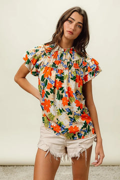 BiBi Multi Color Floral Print Woven Top with frill and ruffles, styled with shorts for a fashionable summer look.