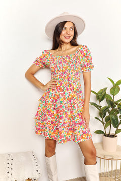 Devine Smocked Sweetheart Neck Flounce Sleeve Mini Dress with floral pattern and playful flounce sleeves.