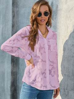 Full Size Collared Neck Long Sleeve Shirt Plus Size in sheer pink fabric with pocket and stylish sunglasses.