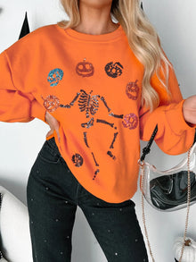 Bright orange Halloween skeleton pumpkin sweatshirt with sequin details, perfect for festive celebrations.