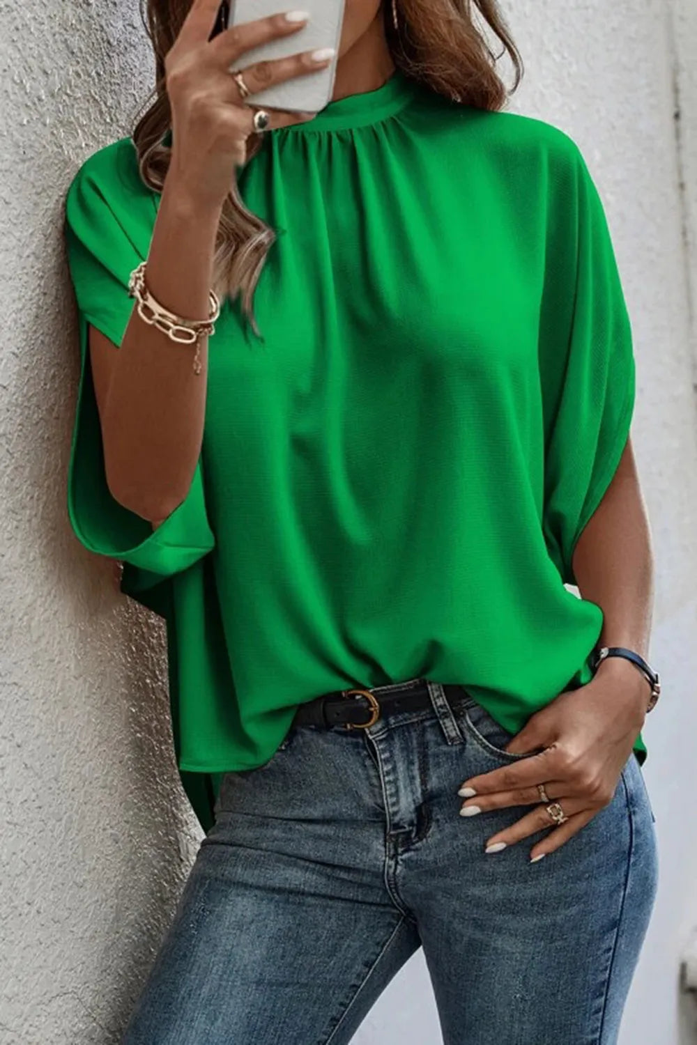 Model wearing a bright green Tie Back Slit Half Sleeve Blouse, showcasing its casual style and comfort.