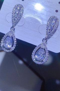2 carat moissanite teardrop earrings in 925 sterling silver, shimmering with sparkling detail, presented on a display card.