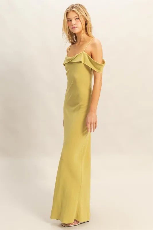 Model wearing the HYFVE Flattering Fit Cami Maxi Dress in olive, showcasing its sleek silhouette and elegant neckline.
