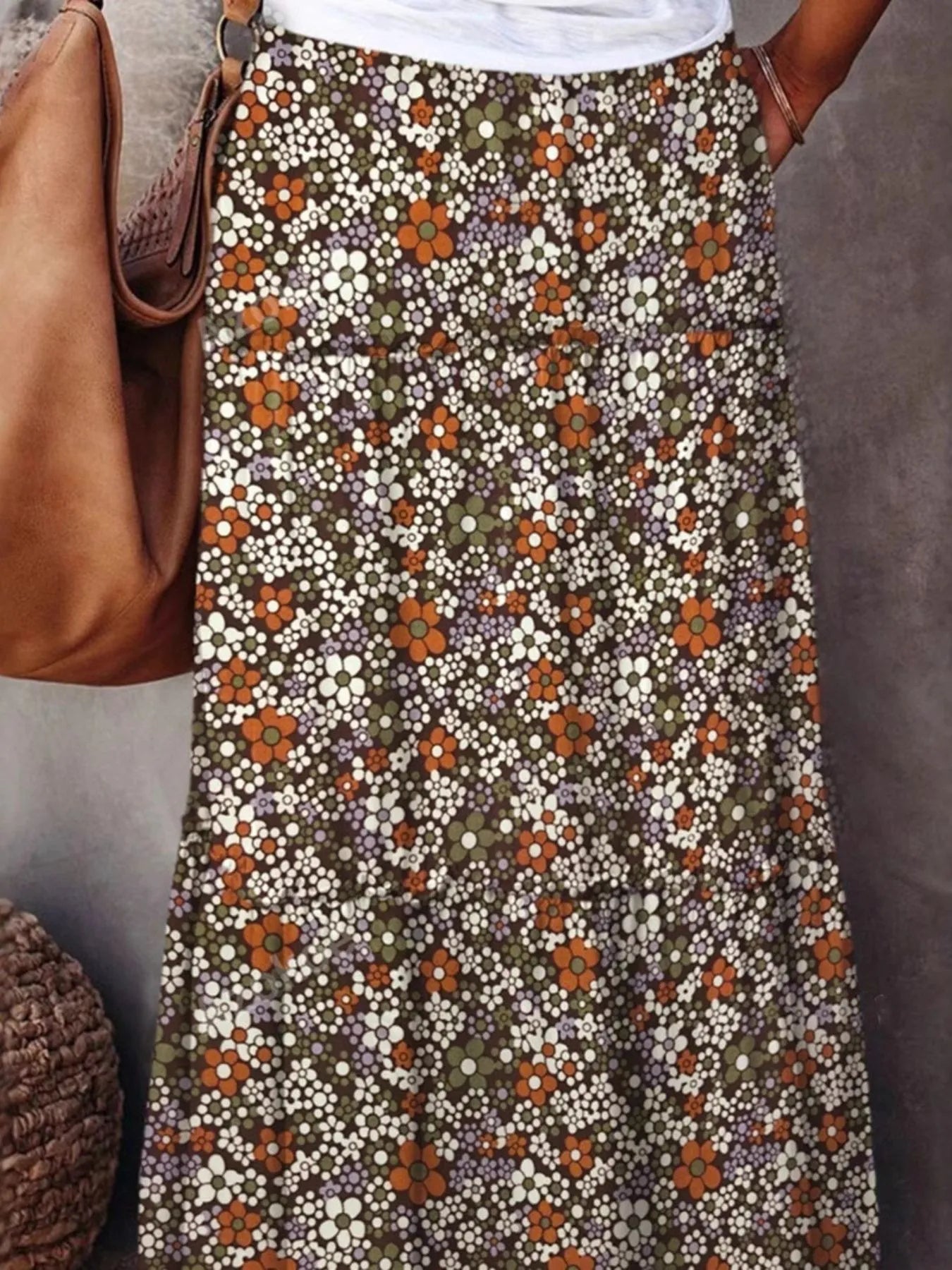 Floral print maxi skirt featuring vibrant blooms in earthy tones, perfect for casual summer outings.