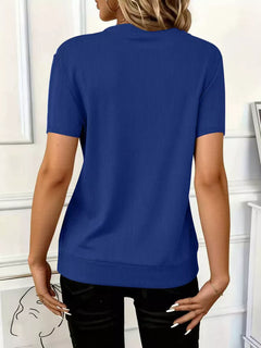 Back view of Half Zip Short Sleeve Top in blue, showcasing ribbed fabric and short sleeves.