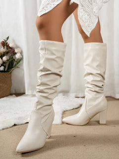 Pointed toe block heel boots in soft white PU leather with a stylish slouch design, perfect for any occasion.
