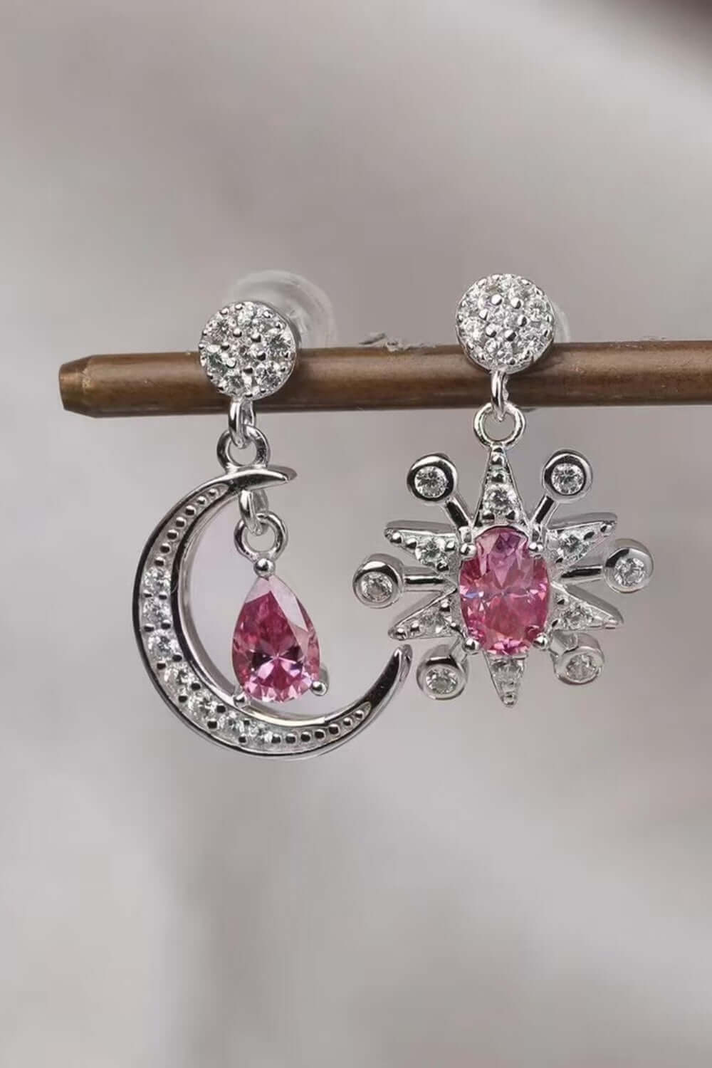 2 carat Moissanite earrings in 925 sterling silver, featuring a moon and star design with pink gemstones.