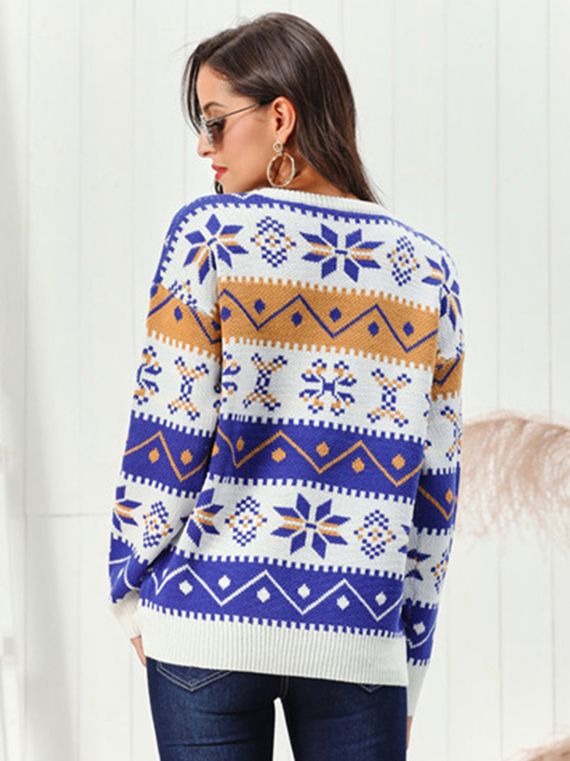 Back view of a stylish Snowflake Pattern Round Neck Sweater with vibrant colors and unique design features.