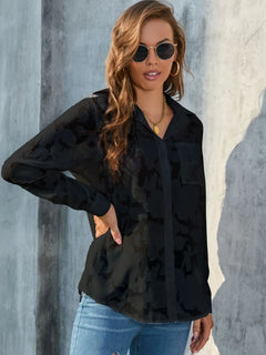 Full Size Collared Neck Long Sleeve Shirt Plus Size in black, featuring pocketed sheer design, model wearing sunglasses.