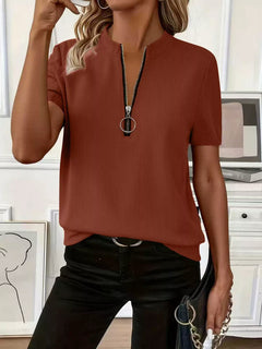 Half Zip Short Sleeve Top in rust color with ribbed texture and zipper detail, perfect for casual outfits.