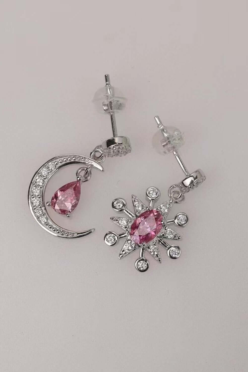 2 carat Moissanite earrings in moon and star design, crafted from 925 sterling silver, featuring pink gemstones.