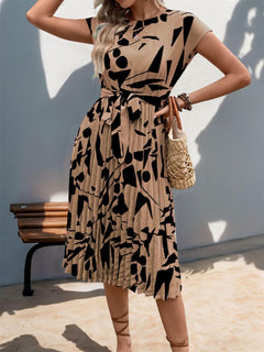 Tied pleated printed cap sleeve dress in beige with black abstract print, perfect for stylish summer outings.