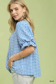 Umgee Gingham Check Blouse with Ruffle Sleeves displayed on model, showcasing blue gingham pattern and ruffle sleeves.
