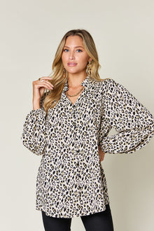 Double Take leopard long sleeve blouse featuring frill sheer detail and a stylish fit, perfect for casual or dressy occasions.