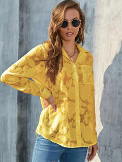 Full Size Collared Neck Long Sleeve Shirt Plus Size in yellow sheer fabric with pocket and stylish sunglasses.