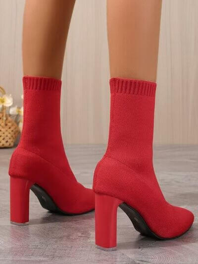 Point toe block heel boots in red with high rubber heels and soft knit design, showcasing stylish footwear for all occasions.
