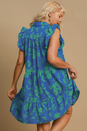 Back view of Umgee plus size floral ruffle tiered dress in blue and green, showcasing cap sleeves and flowy silhouette.