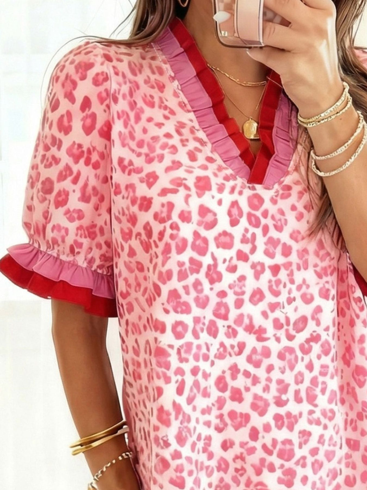 Leopard Print Frill Short Sleeve Blouse featuring a ruffled design and vibrant colors.
