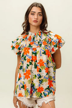 BiBi Multi Color Floral Print Woven Top featuring a vibrant floral design and ruffled details.