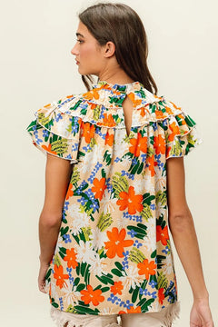 Back view of the BiBi Multi Color Floral Print Woven Top, featuring ruffled sleeves and vibrant floral patterns.