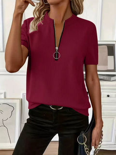 Half Zip Short Sleeve Top in burgundy with ribbed texture and zipper detail, styled casually.
