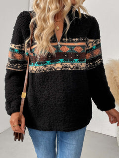 Model wearing a cozy quarter zip geometric long sleeve sweatshirt with a stylish pattern and black color.
