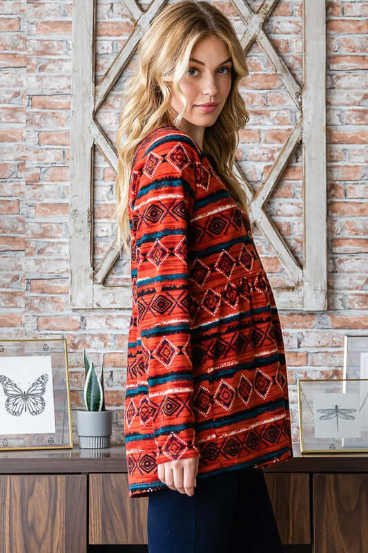 Chic long sleeve babydoll top with geometric pattern and button detail, styled with peplum fit for a trendy look.
