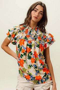 BiBi Multi Color Floral Print Woven Top featuring vibrant floral design and ruffled sleeves, perfect for a summery look.