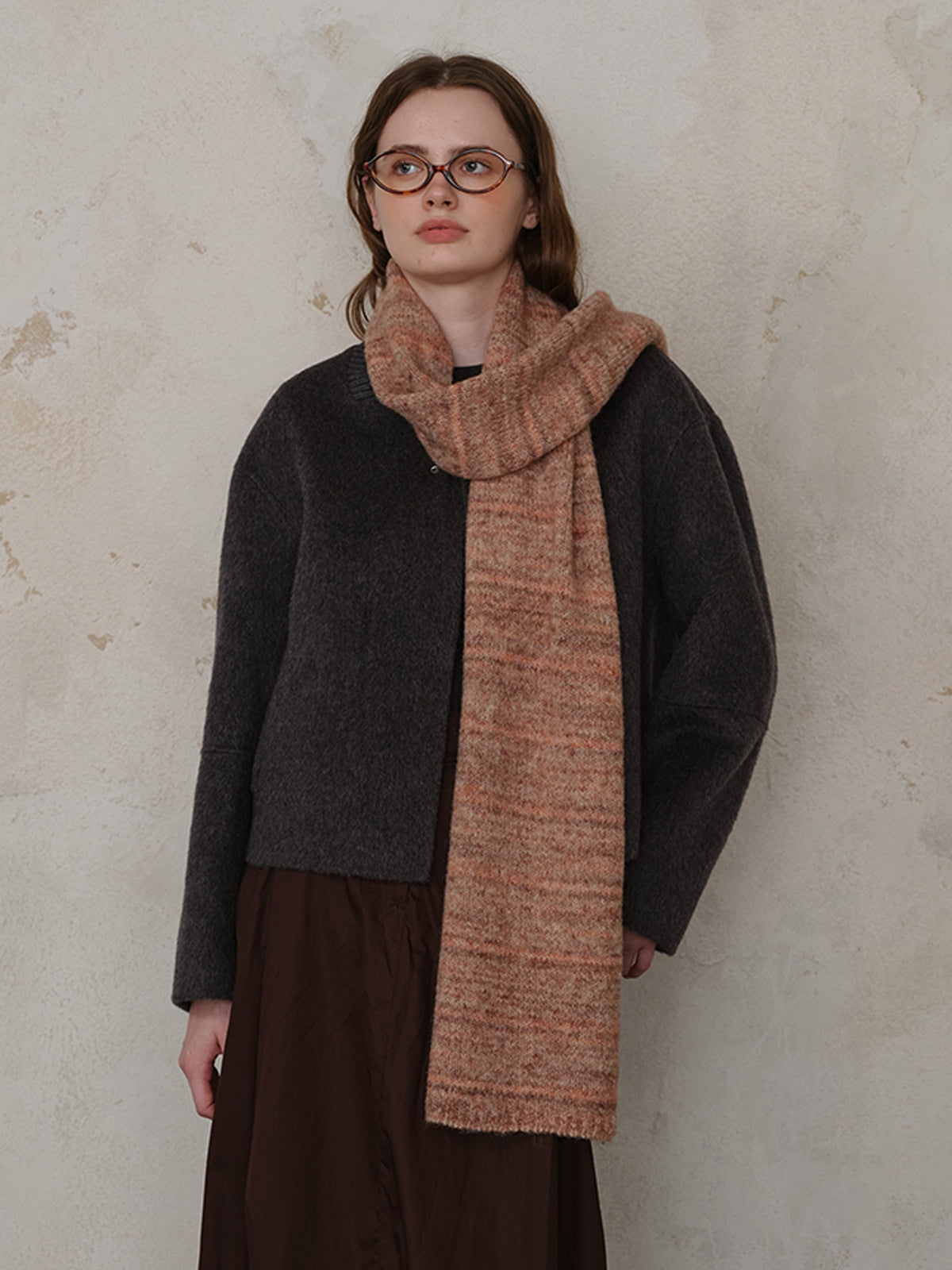 Fashionable striped detail knit scarf made of soft fur, perfect for adding warmth and style to your outfit.