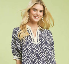 Umgee Geometric Leaf Print Popover Top in a relaxed fit with stylish geometric leaf motif and V-notch neckline.