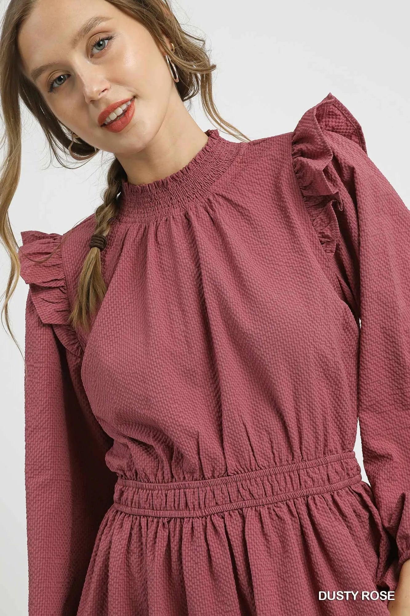 Model wearing Umgee Textured Midi Dress in Dusty Rose with ruffle shoulder detail, showcasing chic and feminine style.
