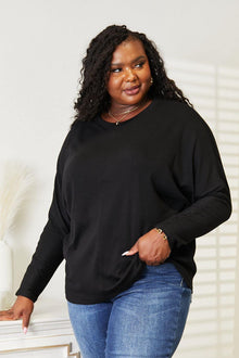 Double Take Seam Detail Round Neck Long Sleeve Top in black, styled casually with jeans.