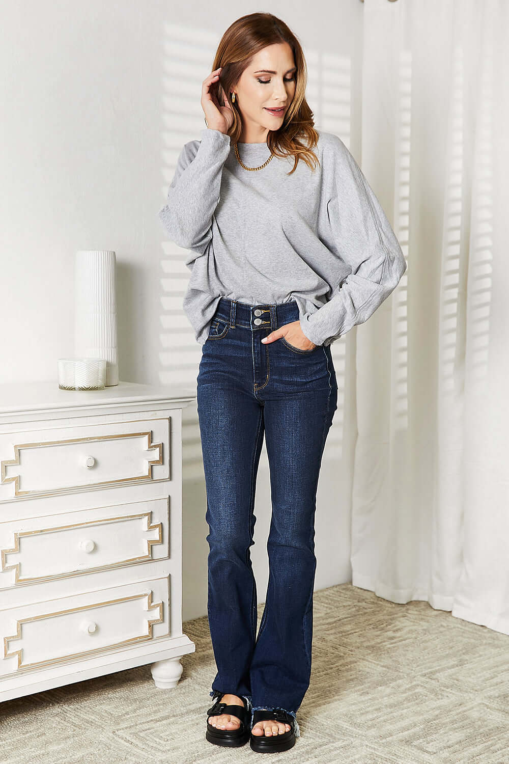 Double Take Seam Detail Round Neck Long Sleeve Top styled with flared jeans, featuring a gray color and comfy design.
