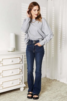Double Take Seam Detail Round Neck Long Sleeve Top styled with flared jeans, featuring a gray color and comfy design.