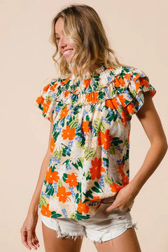 BiBi Multi Color Floral Print Woven Top featuring a vibrant floral design and ruffled sleeves, perfect for summer outfits.