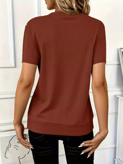 Half Zip Short Sleeve Top in ribbed fabric, showcasing the back design in a warm brown color.