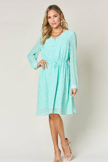 Double Take full size printed ruched V-neck long sleeve dress in mint green, featuring a cinched waist and elegant design.