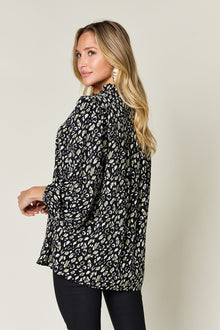 Double Take leopard long sleeve blouse, sheer frill design, stylish black and cream pattern, perfect for casual wear.