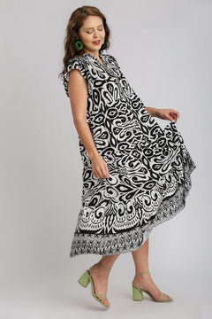 Umgee Plus Size Two-Tone Midi Dress with Ruffle Cap Sleeves and Border Print in black and white