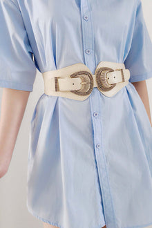 Shell Double Buckle Elastic Wide Belt in cream color, paired with a light blue shirt, showcasing its stylish design and unique buckles.