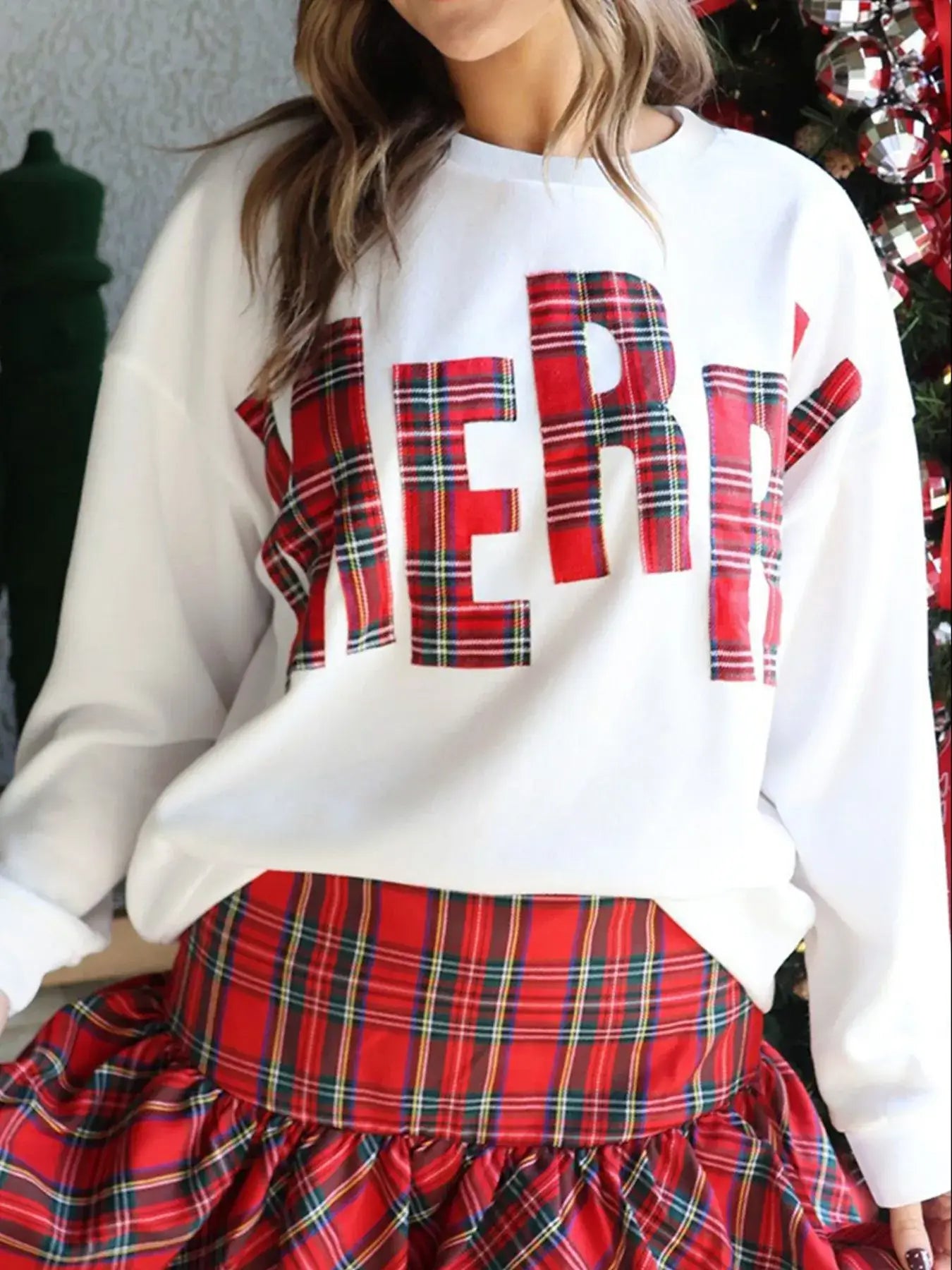 Plaid MERRY Christmas Vacation Sweatshirt featuring a festive plaid design with 'MERRY' lettering.