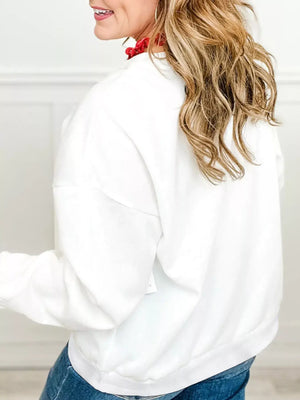 Model showcasing the back view of the Plaid MERRY Christmas Vacation Sweatshirt in white.