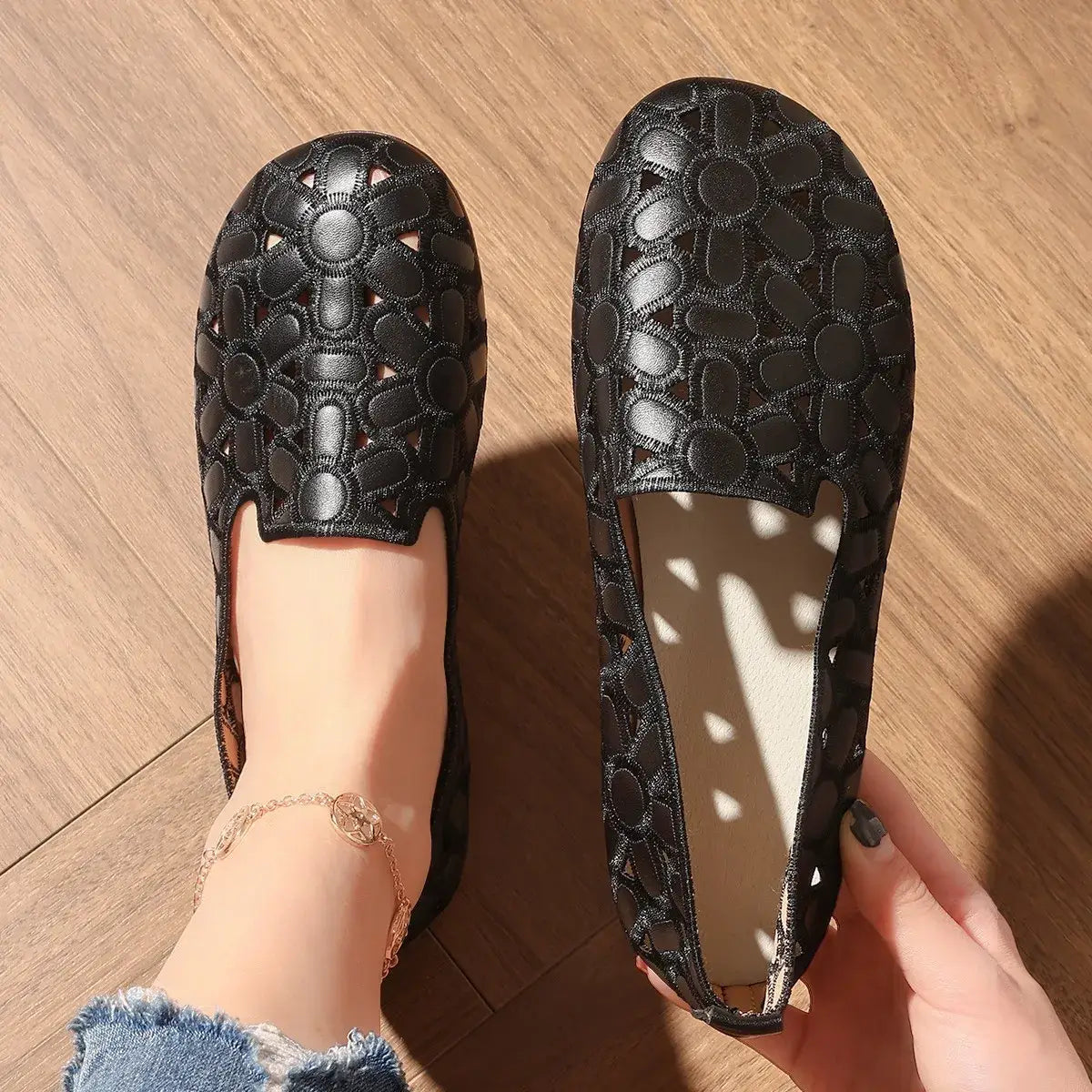 Elegant round toe flats loafers featuring embossed geometric pattern in black synthetic leather.