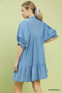 Umgee Smocked Bib Ruffle Hem Babydoll Dress in periwinkle, showcasing puff sleeves and ruffle hem detail.