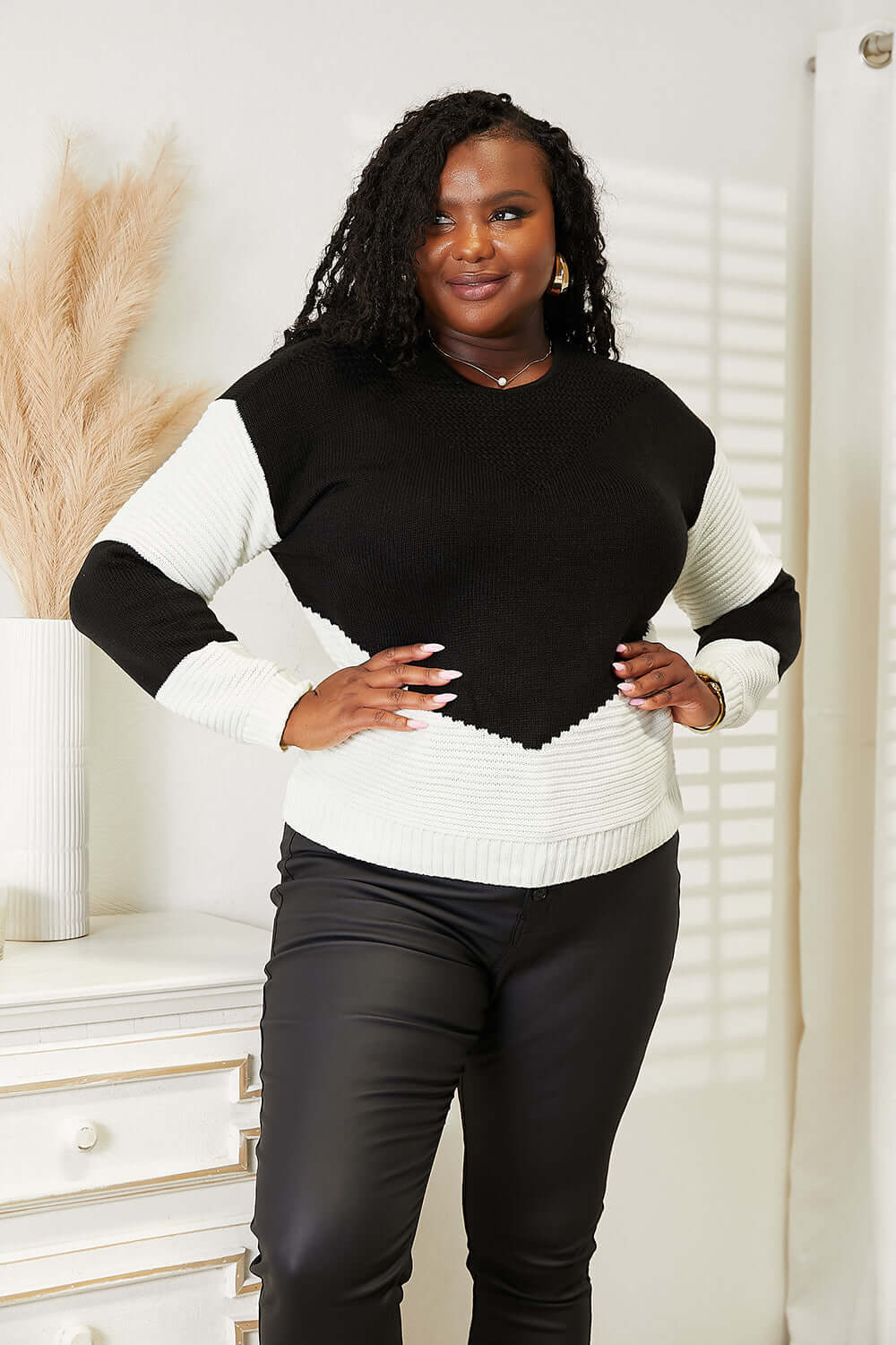 Woven Right Two-Tone Openwork Rib-Knit Sweater featuring a model wearing a stylish black and white design.