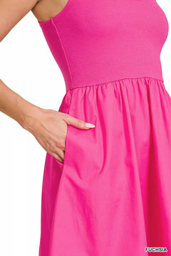 Zenana Combined Knit & Woven Midi Dress showcasing a close-up of the fuchsia knit bodice and flowing skirt with pockets.
