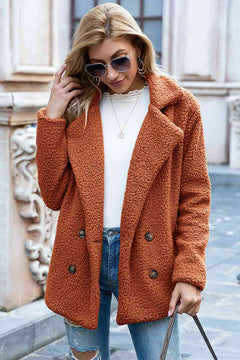Stylish woman in a full size lapel collar sherpa coat, perfect for casual urban outfits.