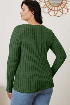 Back view of a plus-size woman wearing a green ribbed long sleeve V-neck T-shirt with a relaxed fit.