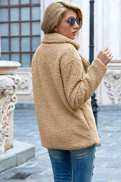 Fashionable woman in a casual full size lapel collar sherpa coat, showcasing a stylish urban look.