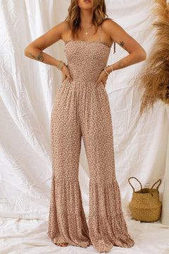 Floral Spaghetti Strap Smocked Wide Leg Jumpsuit worn by a model, showcasing its elegant design and floral pattern.